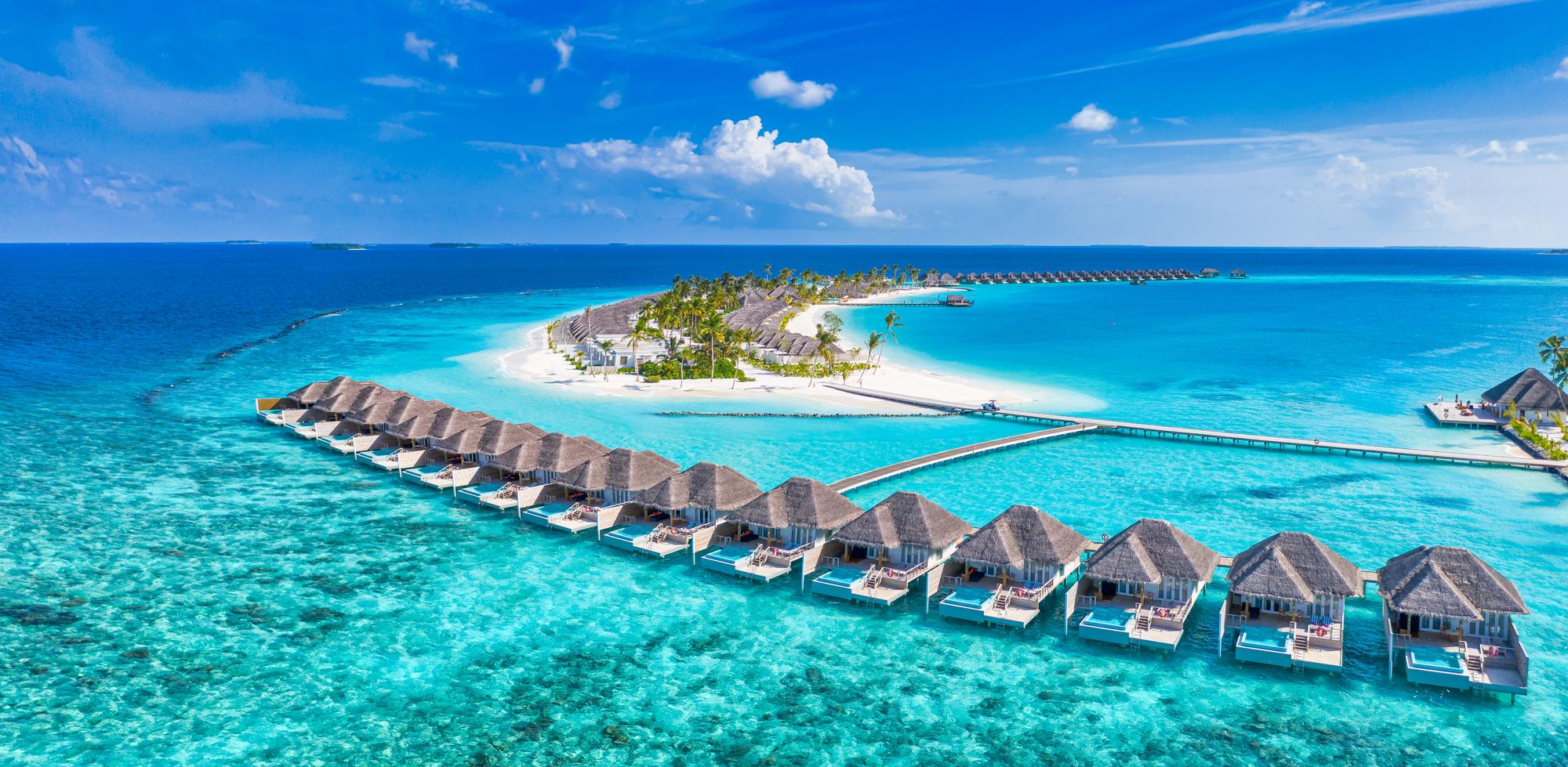 20230823162608_fpdl.in_aerial-bungalows-villas-amazing-sea-lagoon-bay-beach-exotic-destination-summer-vacation-wallpaper_663265-3704_full.jpg